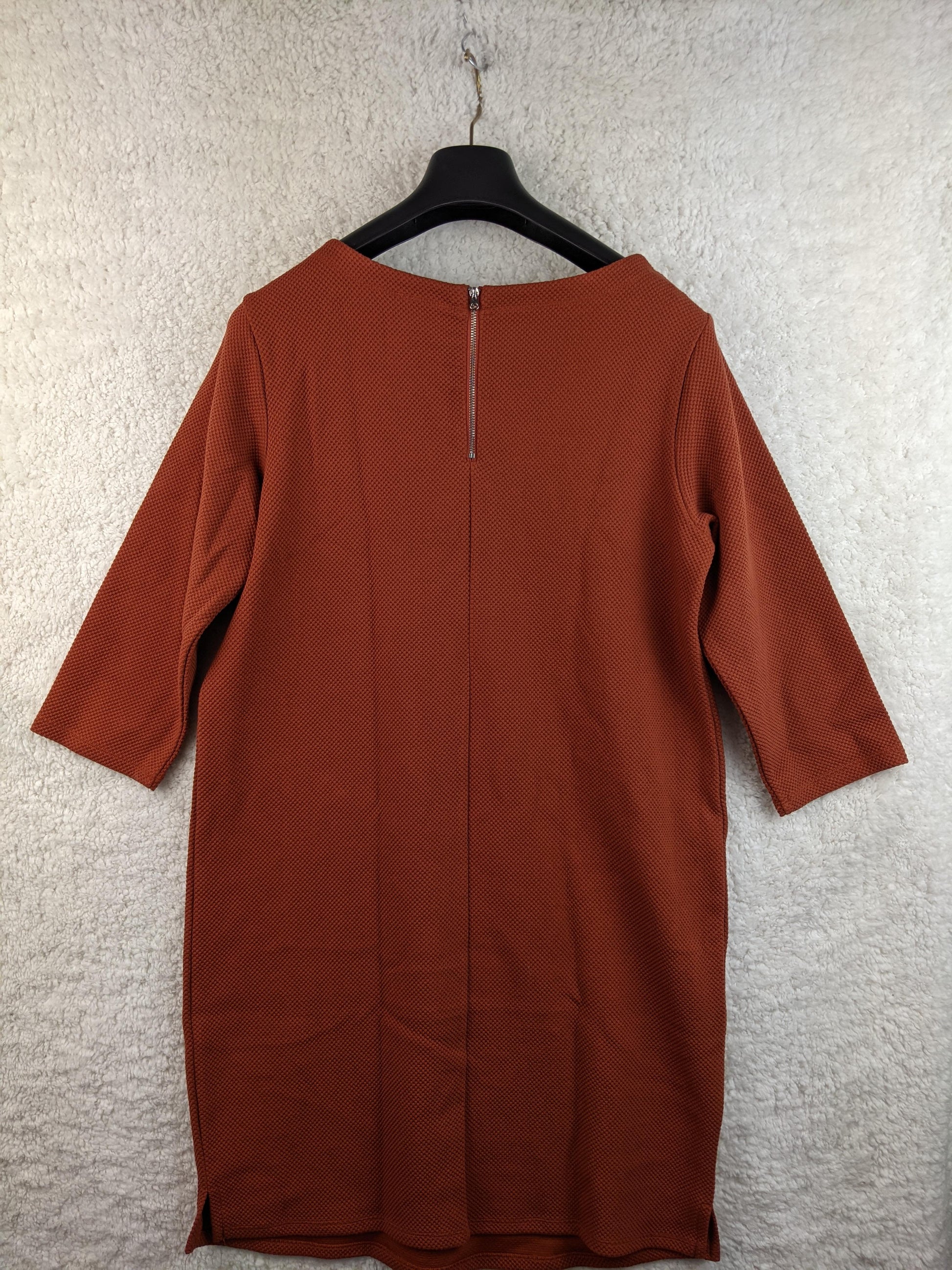 Back view of burnt orange knee-length dress