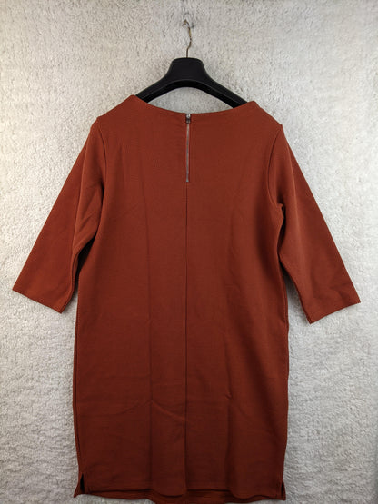Back view of burnt orange knee-length dress