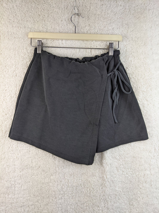 Gray wrap-style shorts with tie detail on hanger