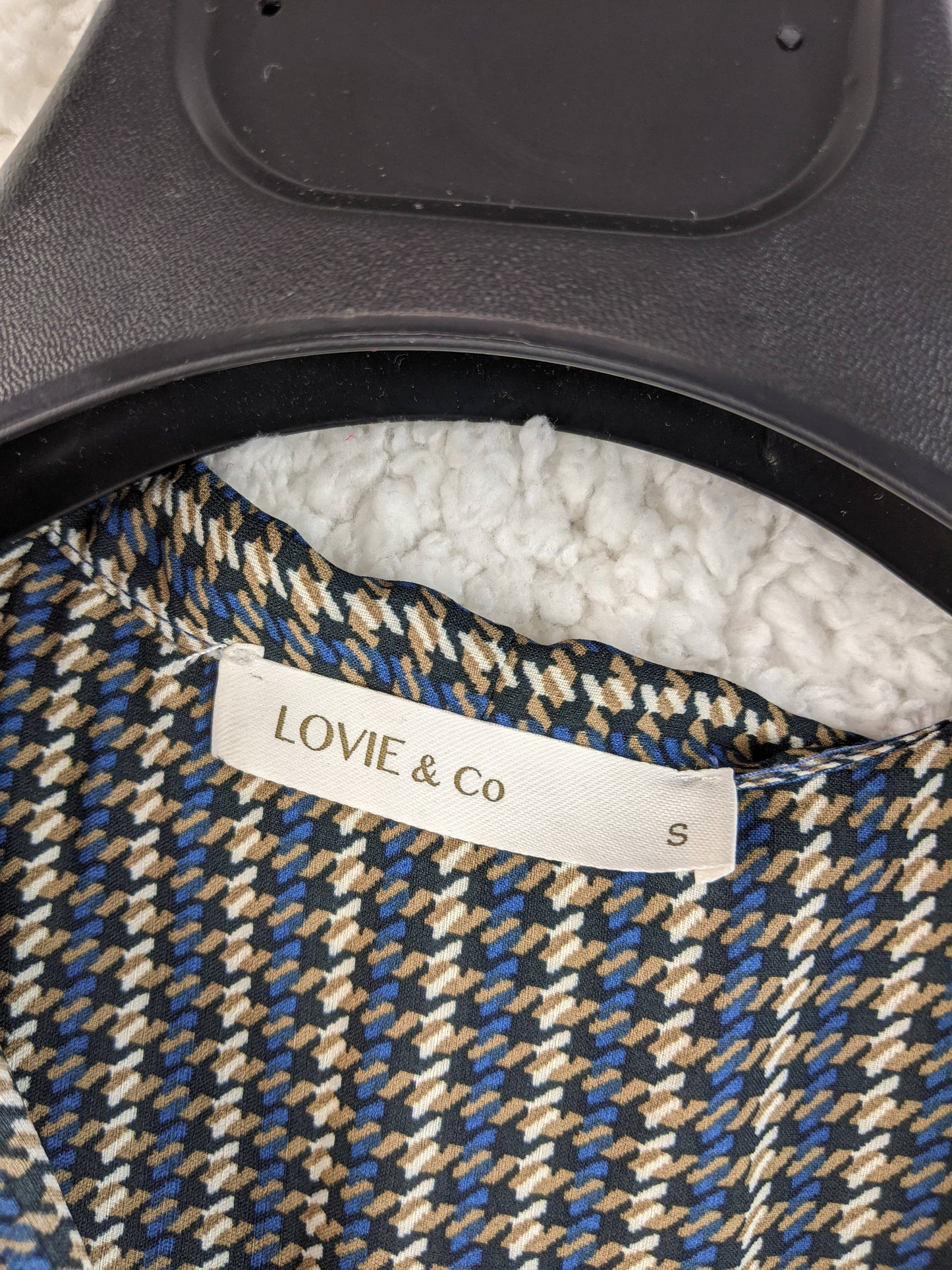 Close-up of label showing 'Lovie & Co' and size 'S'
