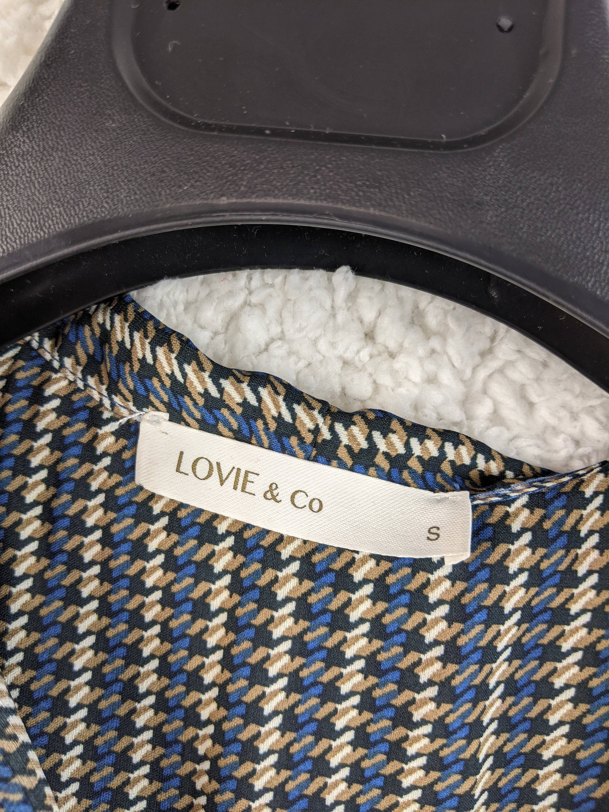 Close-up of label showing 'Lovie & Co' and size 'S'