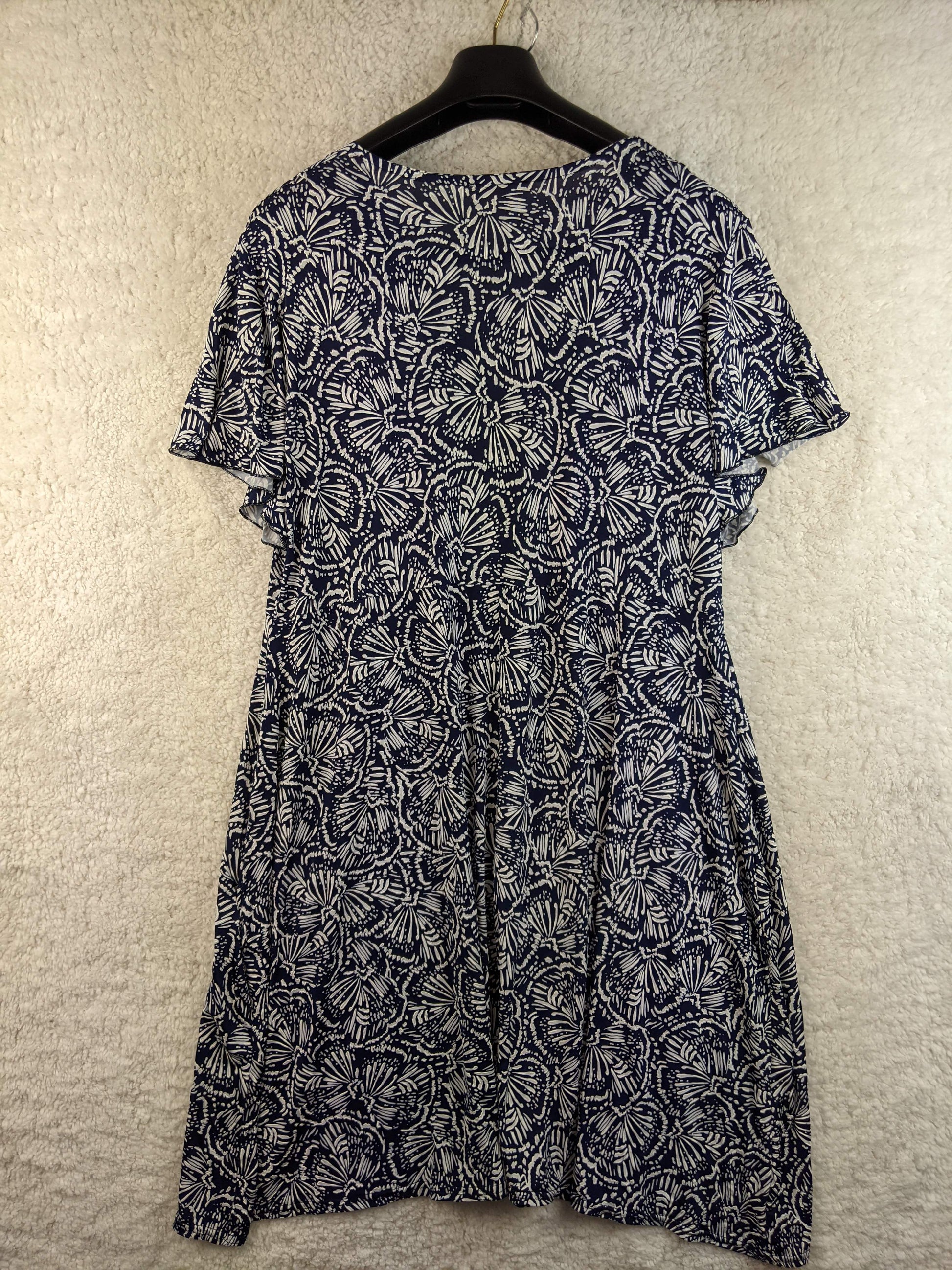Back view of navy and white floral dress