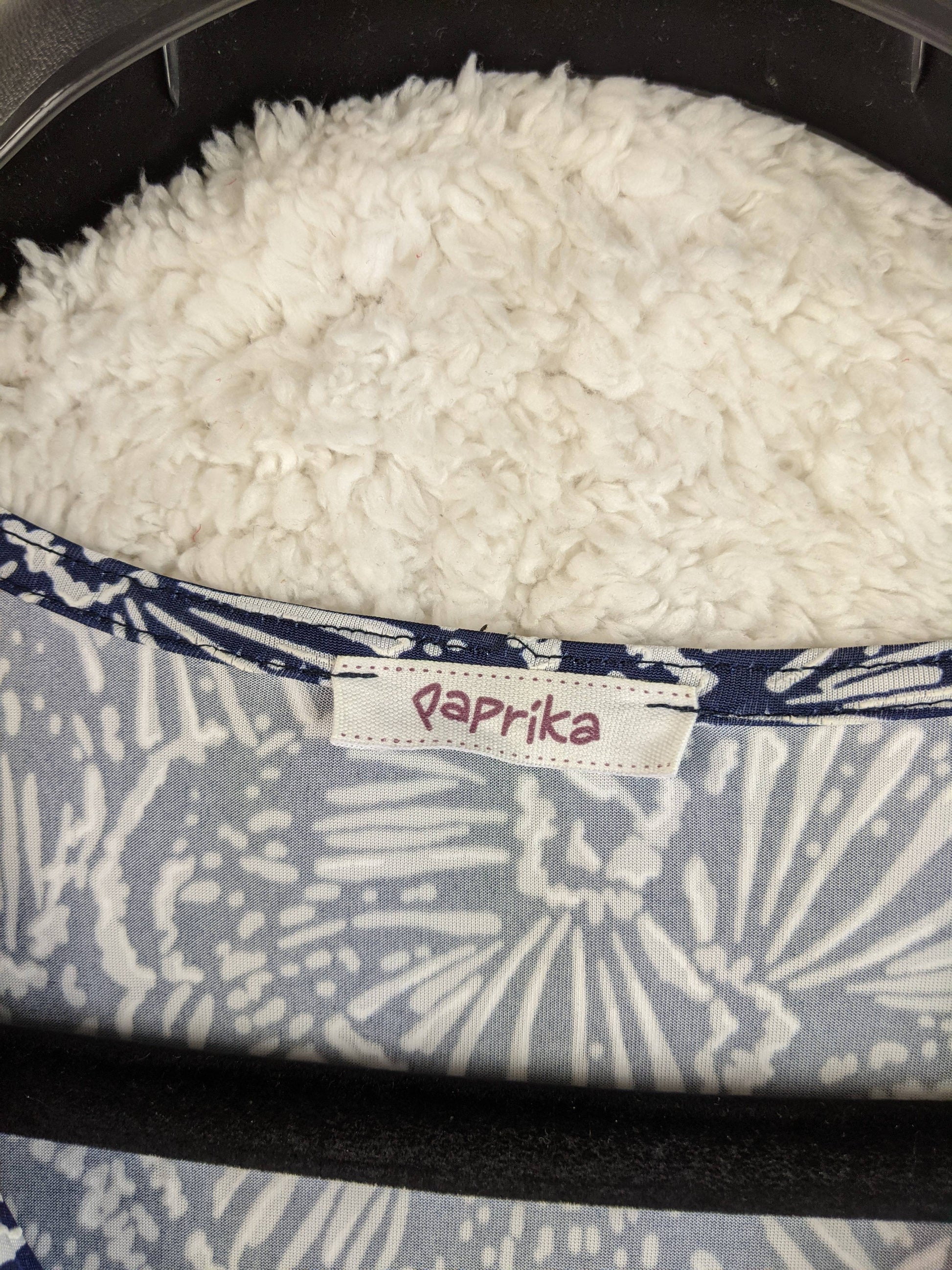 Brand label on navy and white floral dress