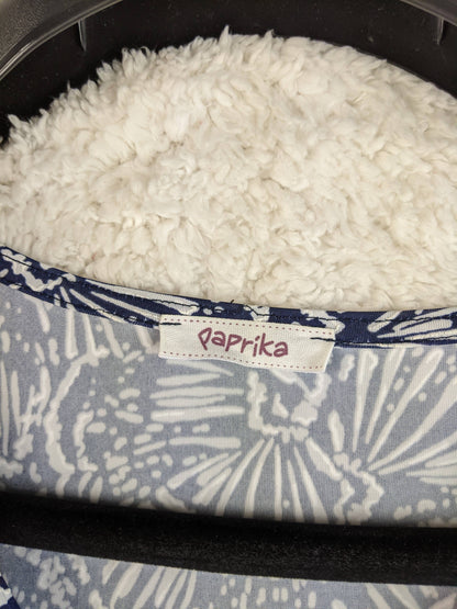 Brand label on navy and white floral dress