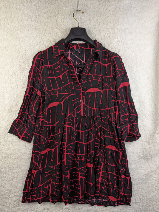 Front view of black and red printed Desigual dress on a hanger