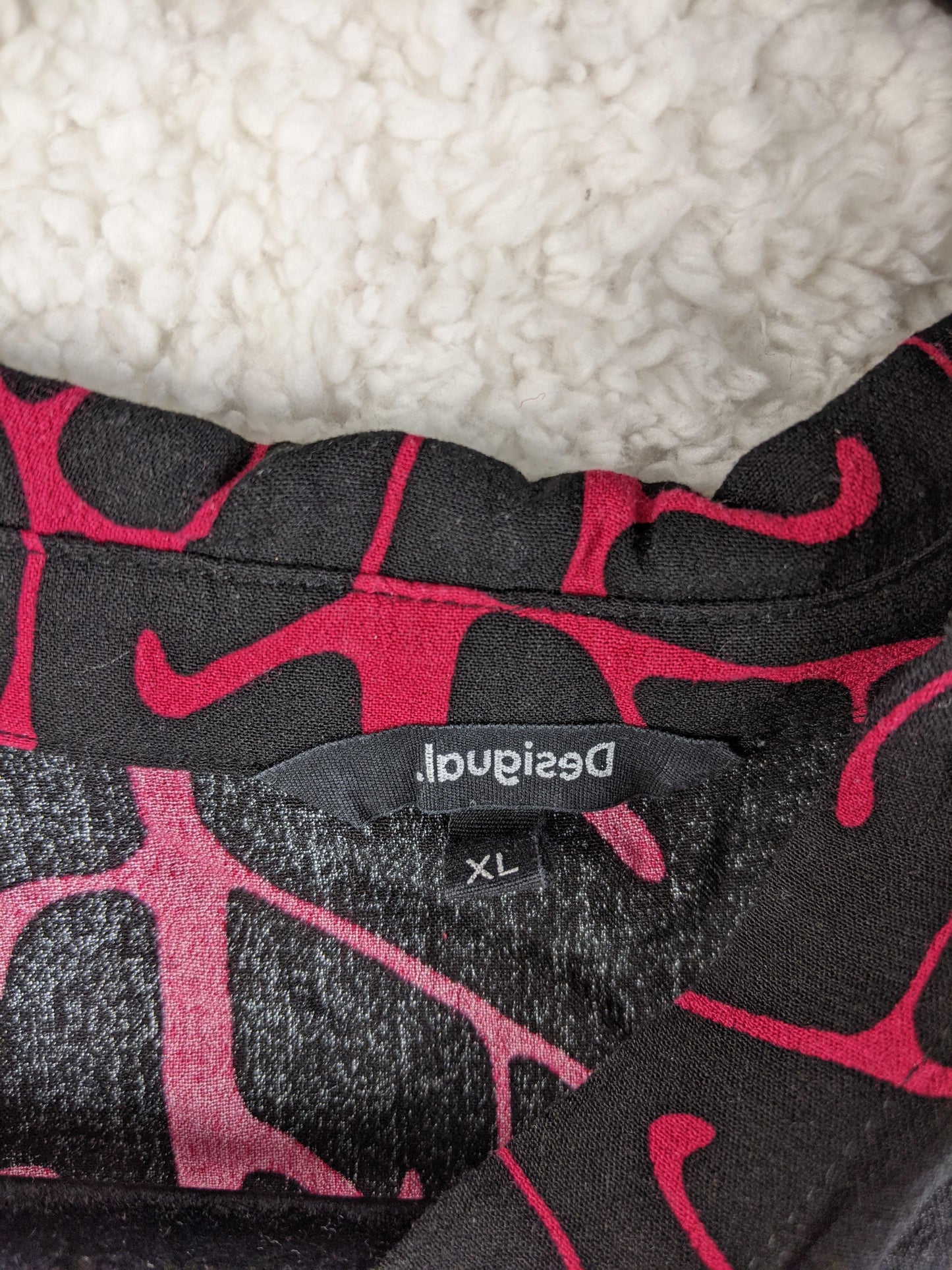 Close-up of Desigual label showing size XL
