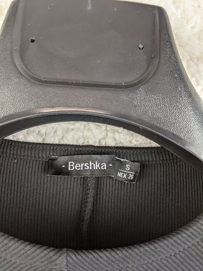 Close-up of Bershka label on dress