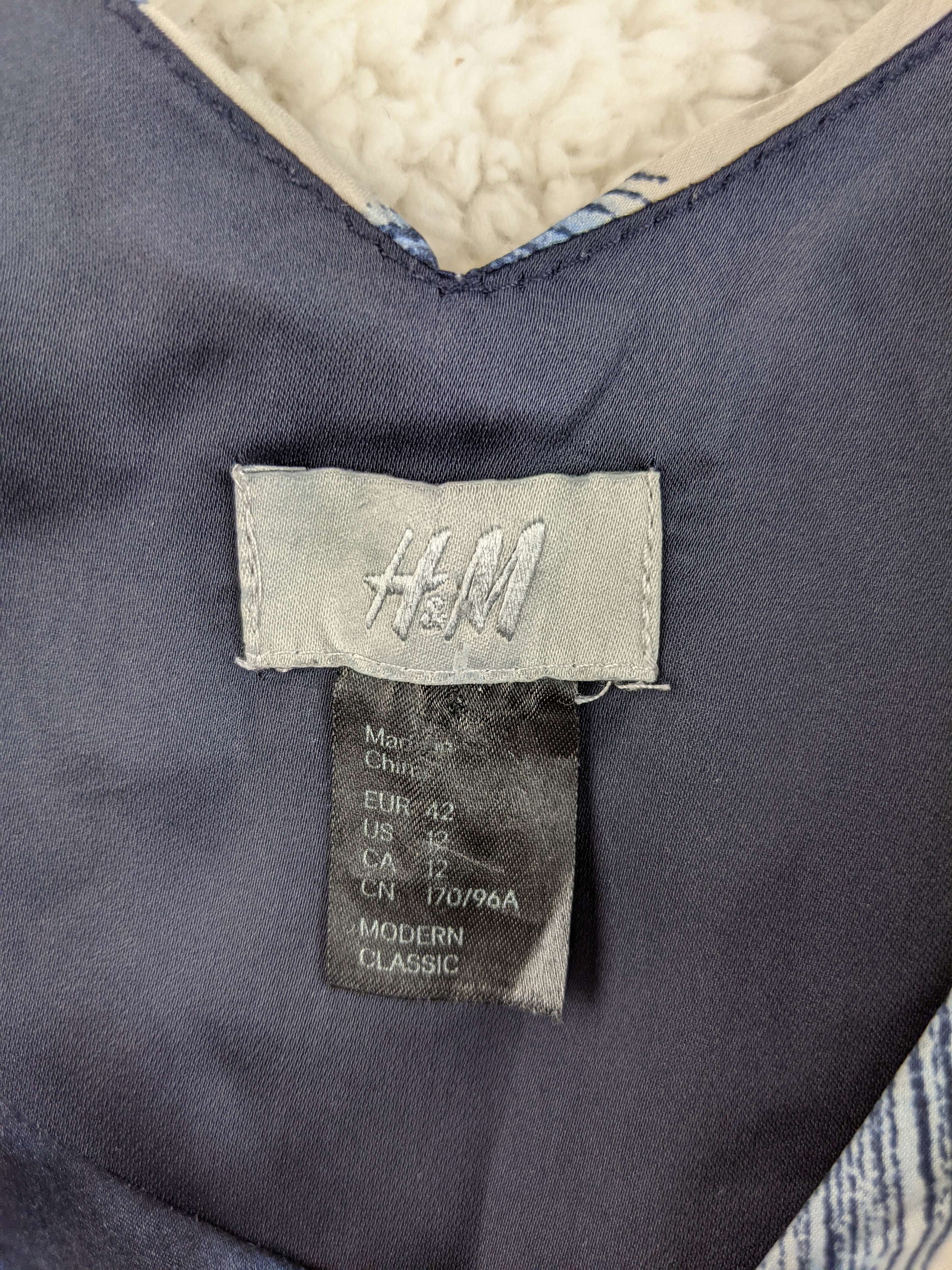 Close-up of H&M dress label showing size 42