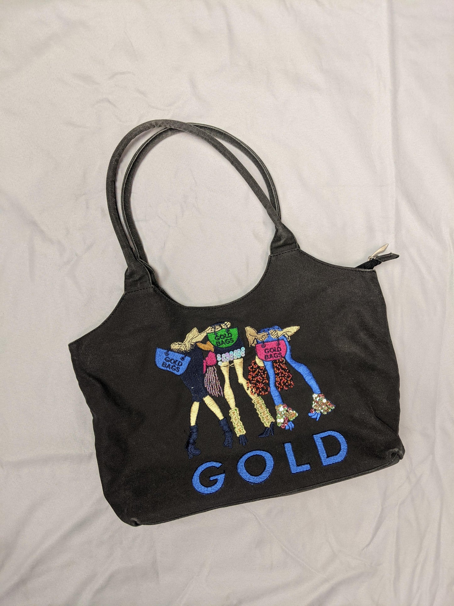 Front view of vintage black tote bag with embroidery