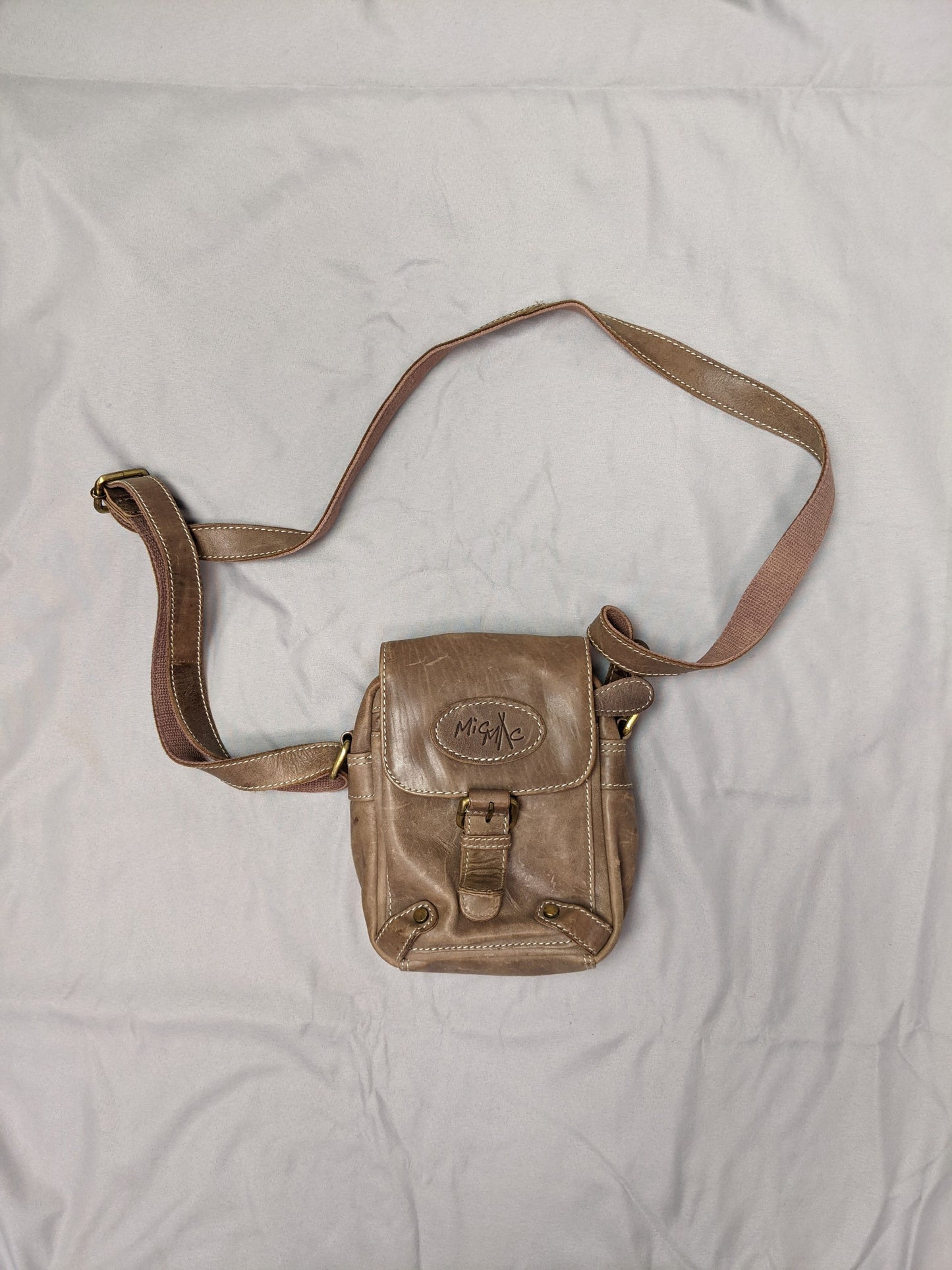 Front view of MioMi brown faux leather crossbody bag