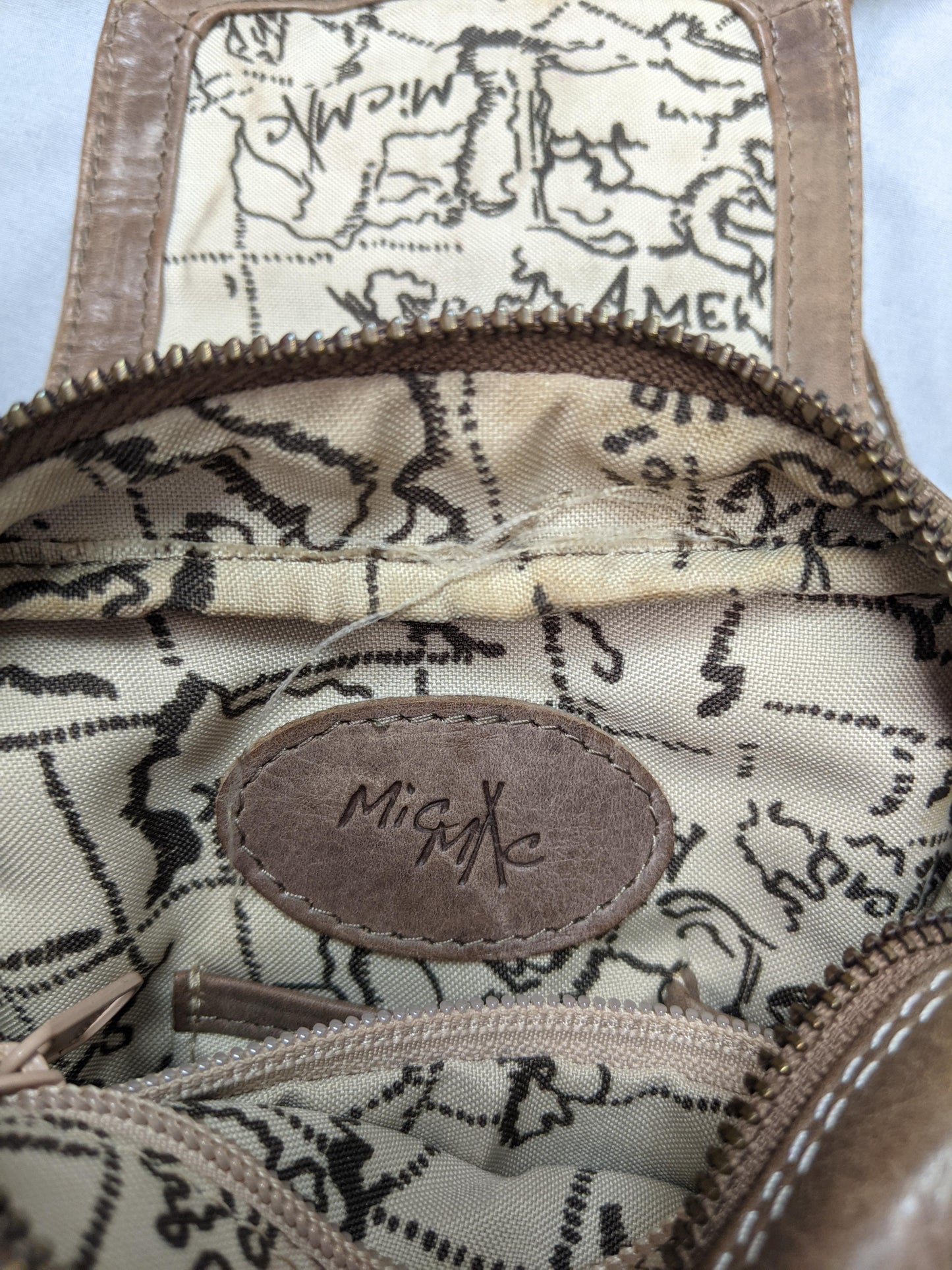 Interior view of MioMi brown faux leather crossbody bag