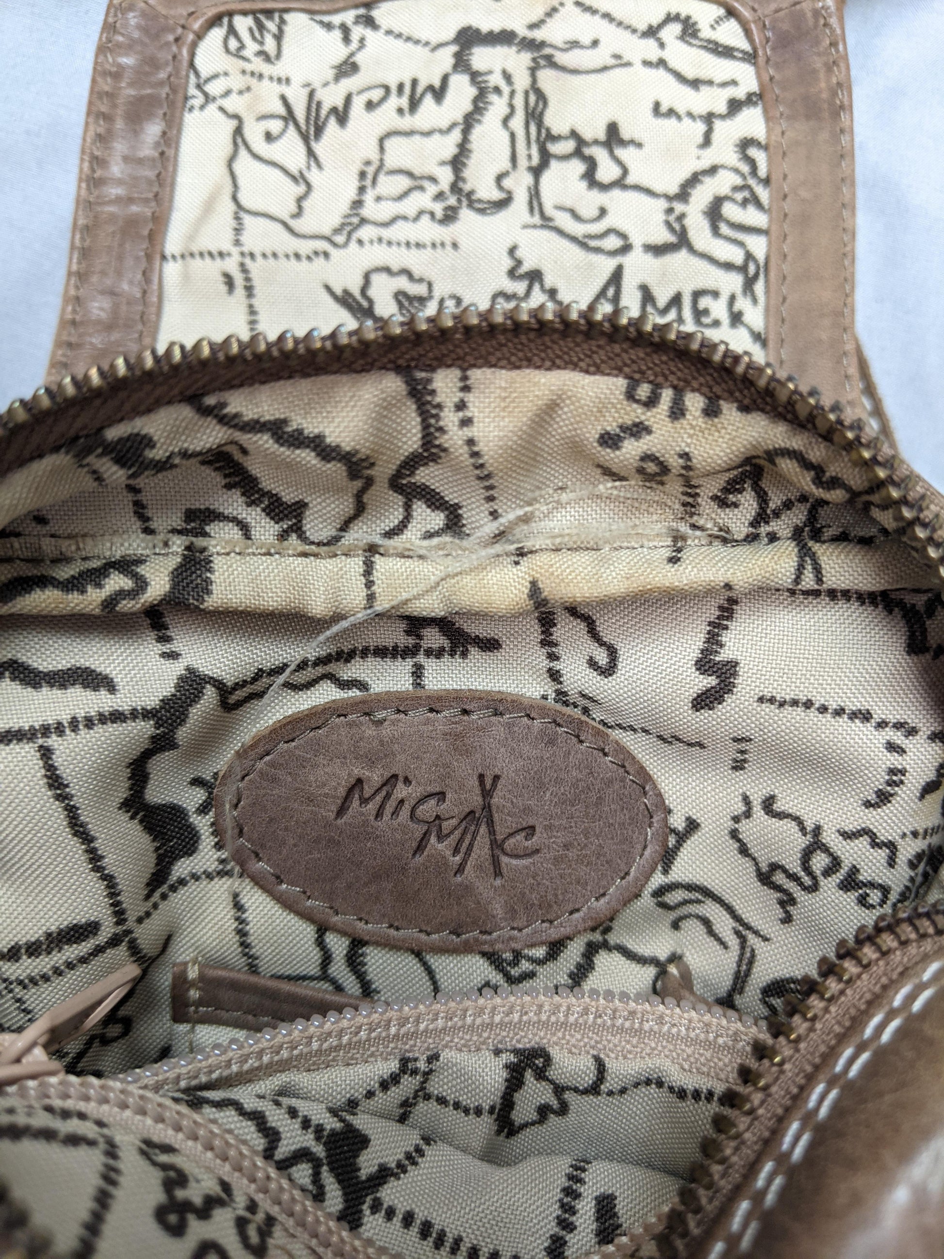 Interior view of MioMi brown faux leather crossbody bag