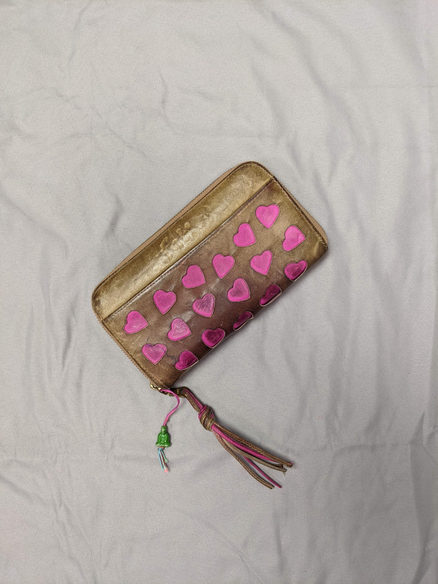 Front view of heart-patterned wallet with tassel