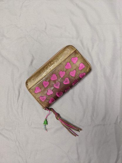 Front view of heart-patterned wallet with tassel