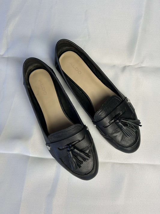 Top view of black Aldo loafers with tassels