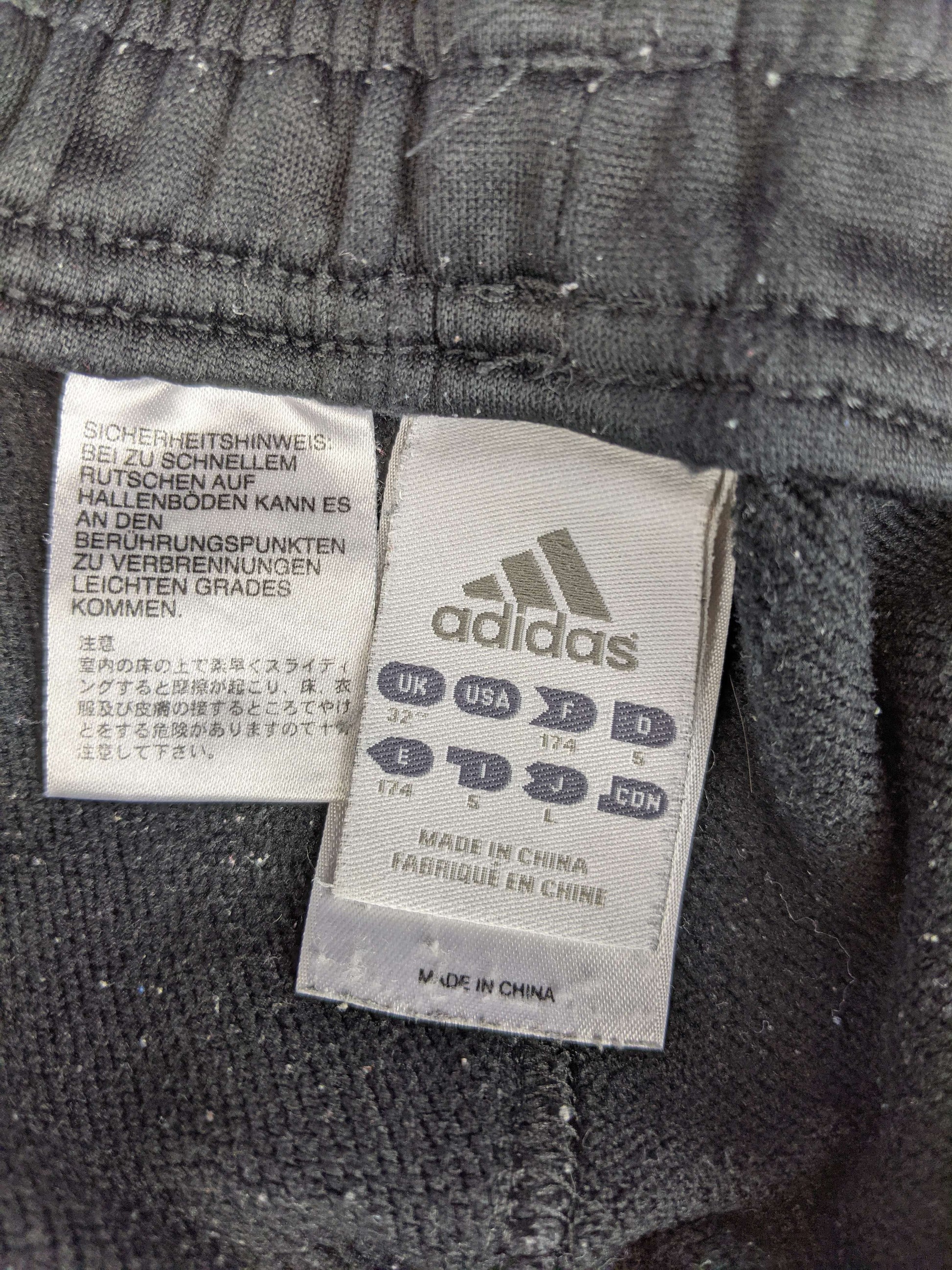 Size label of Adidas AC Milan black training shorts
