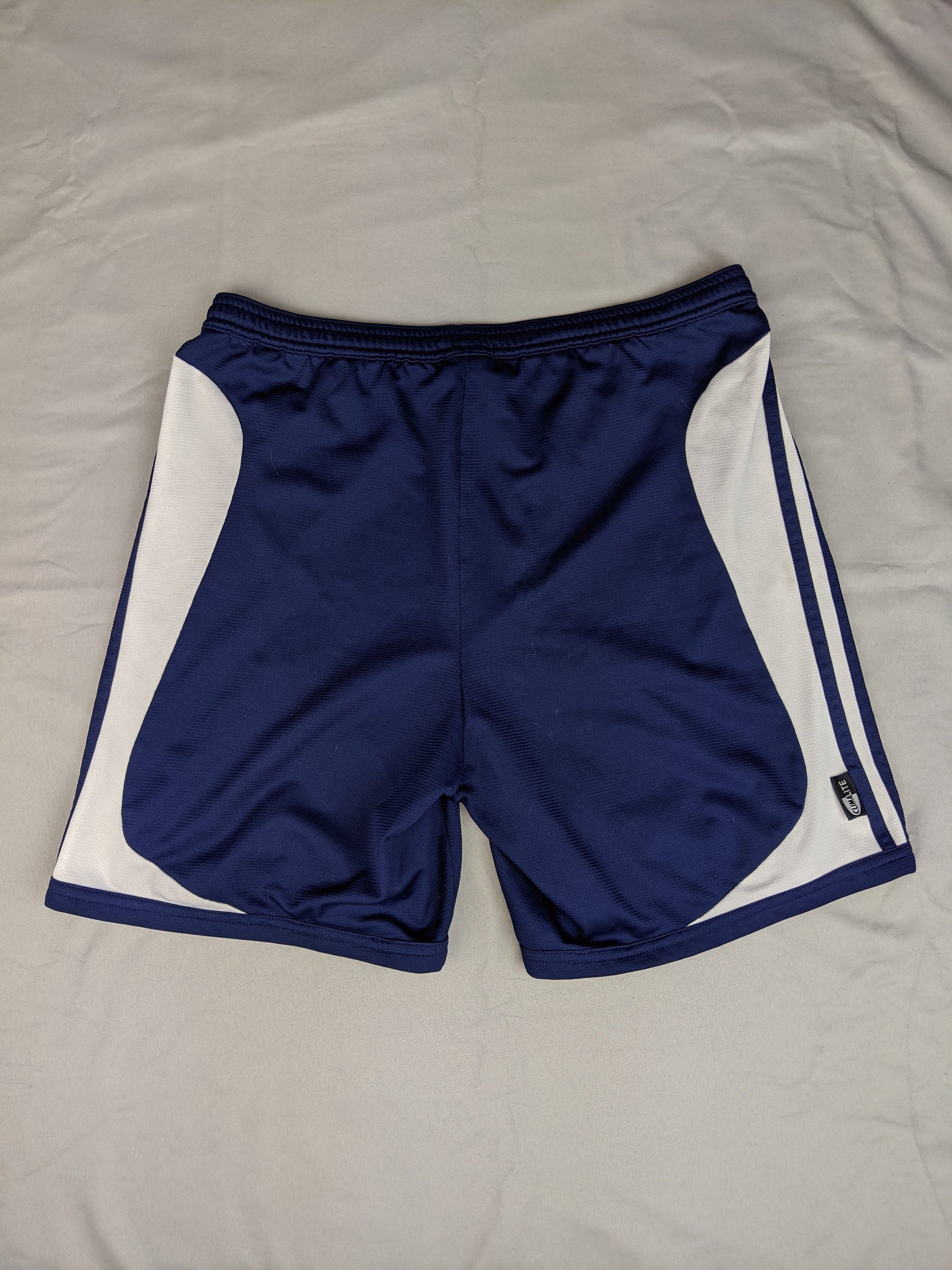 Back view of navy blue Adidas sports shorts