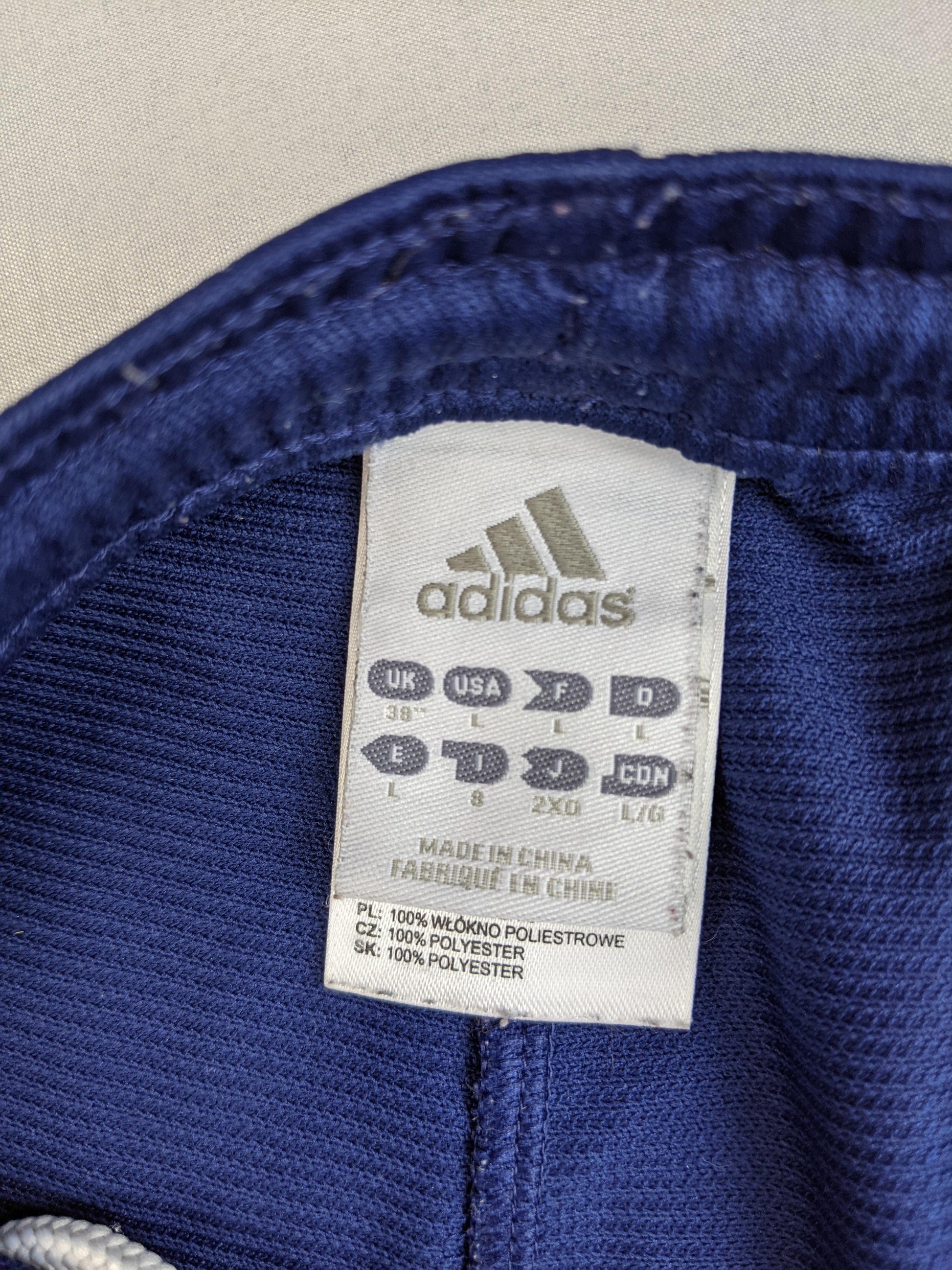 Size label on Adidas navy blue shorts