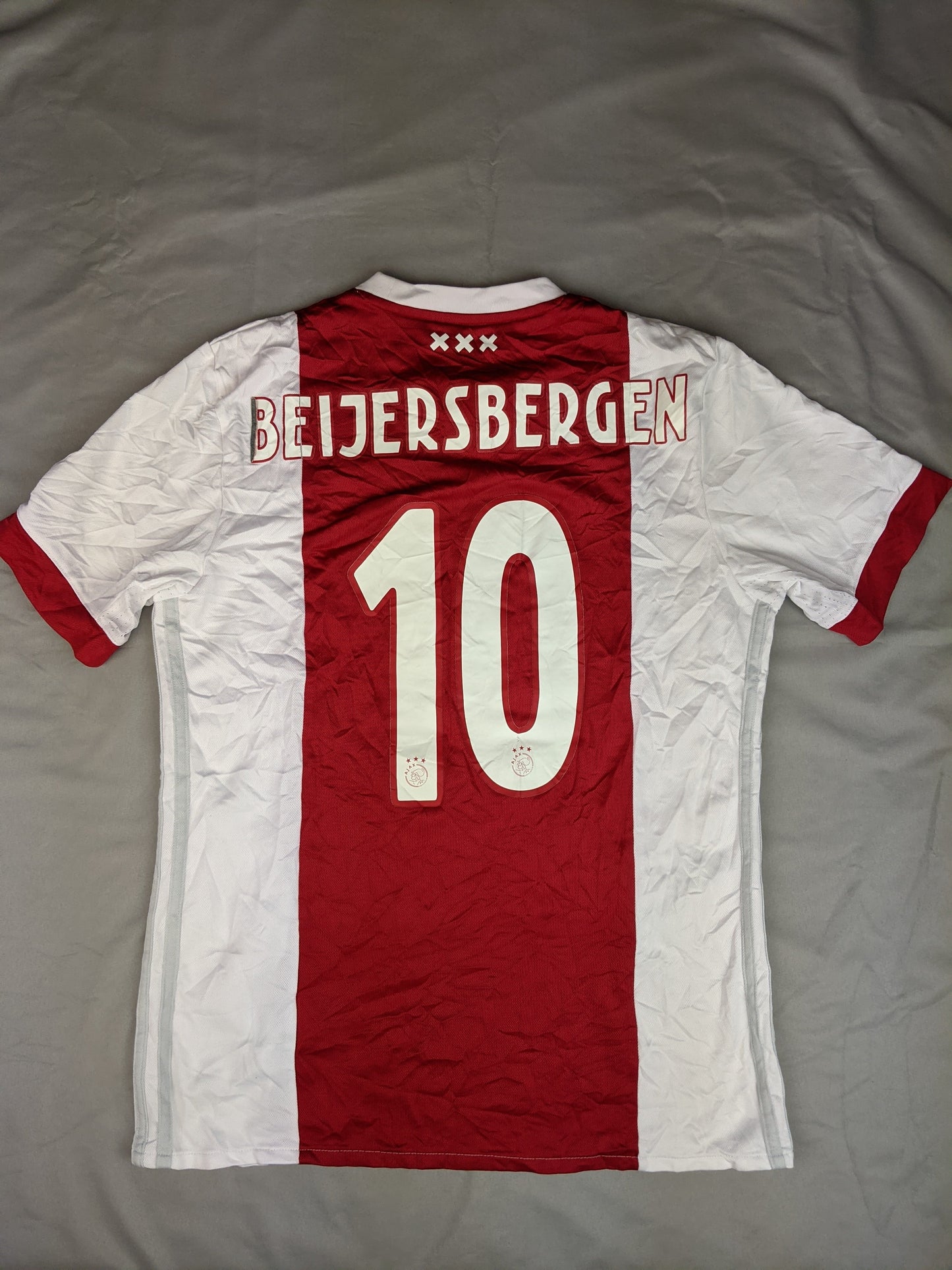 Back view of Adidas red and white Ajax football jersey with number 10