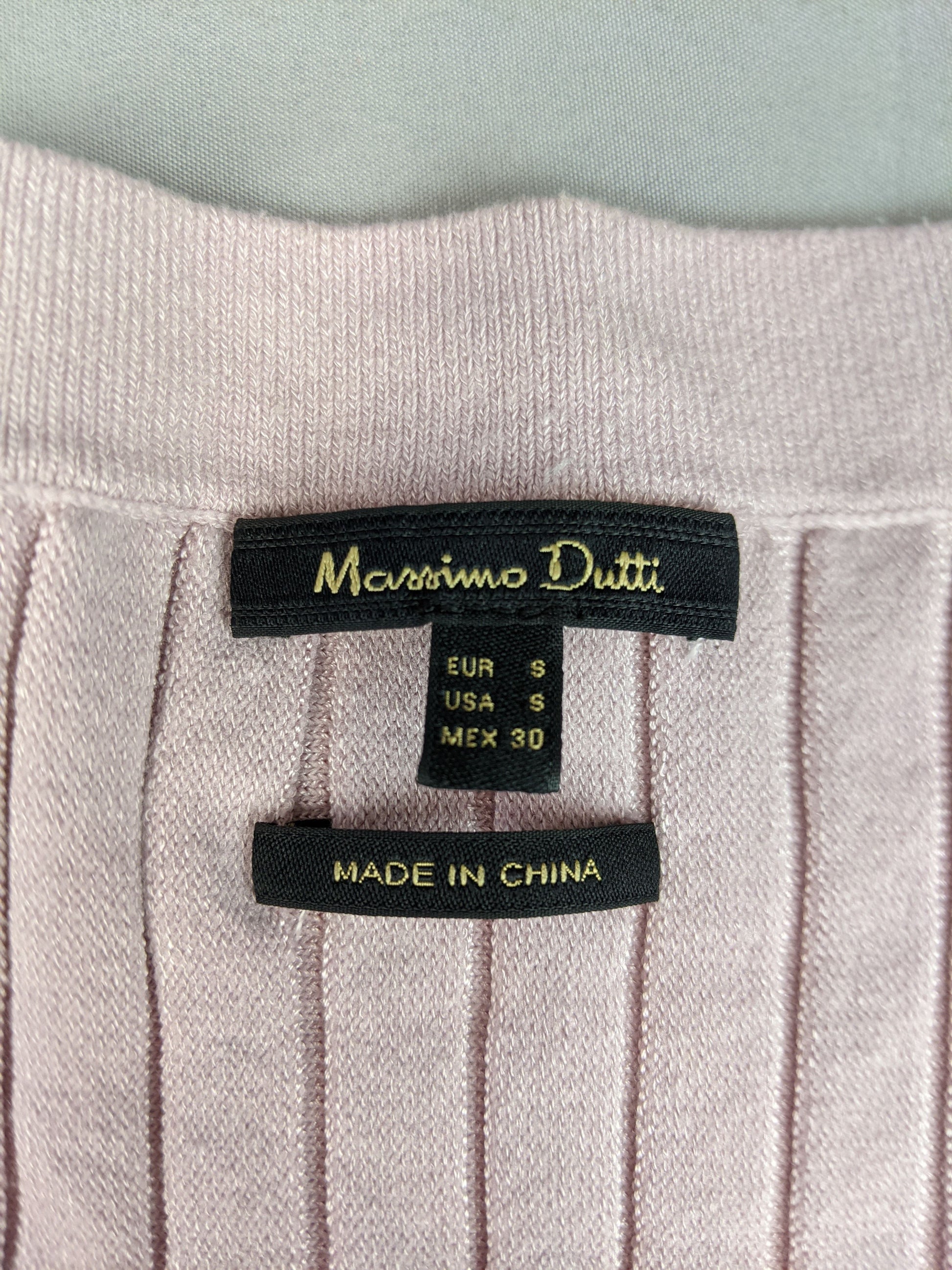 Close-up of Massimo Dutti label on cardigan